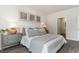 Stylishly decorated bedroom with neutral tones, decorative pillows and prints at 692 Wallace Dr., Little River, SC 29566