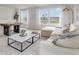 Light-filled living room features neutral decor, a plush sectional, and a stylish coffee table at 692 Wallace Dr., Little River, SC 29566