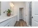 Beautiful bathroom featuring double sinks, quartz countertop, and a glass-enclosed shower at 746 Plumage Ct., Myrtle Beach, SC 29588