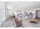 Sun-drenched living room connected to the kitchen and dining area, ideal for entertaining at 746 Plumage Ct., Myrtle Beach, SC 29588