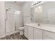 Bathroom with shower, toilet, and vanity sink with storage and large mirror at 750 Charter Dr. # E-2, Longs, SC 29568