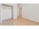 Bedroom showcasing a closet with wire shelving and light wood flooring at 750 Charter Dr. # E-2, Longs, SC 29568