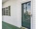 Close-up of the front door with a window and green shutters at 750 Charter Dr. # E-2, Longs, SC 29568