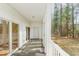 Inviting covered patio with neutral carpet, white ceiling, and sliding glass doors opening to the outdoors at 750 Charter Dr. # E-2, Longs, SC 29568