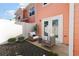 Cozy back patio featuring outdoor seating, pea gravel, and lovely light-coral exterior siding at 763 Moen Pl. # 763-A, Myrtle Beach, SC 29577