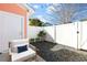 Private backyard featuring a chair, white fence and stone ground cover at 763 Moen Pl. # 763-A, Myrtle Beach, SC 29577