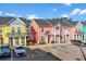 Colorful townhomes, each two stories, featuring parking spaces and welcoming front porches and balconies at 763 Moen Pl. # 763-A, Myrtle Beach, SC 29577