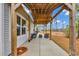 Covered back patio area with seating, a ceiling fan, and wood supports at 820 Wild Leaf Loop, Conway, SC 29526