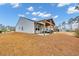 View of backyard and covered patio of house, a great place for outdoor living and entertaining at 820 Wild Leaf Loop, Conway, SC 29526