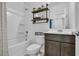 This bathroom features a shower-tub, white toilet, and dark vanity at 820 Wild Leaf Loop, Conway, SC 29526