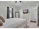 Comfortable bedroom with a ceiling fan, a TV, a mirror and soft, neutral decor at 820 Wild Leaf Loop, Conway, SC 29526