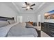 Spacious bedroom with neutral colors, fan, mounted tv, and minimalist design at 820 Wild Leaf Loop, Conway, SC 29526