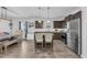 This kitchen features stainless steel appliances, dark cabinets, and an island with seating at 820 Wild Leaf Loop, Conway, SC 29526