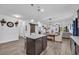 Open concept with island, granite countertops, and dark cabinetry at 820 Wild Leaf Loop, Conway, SC 29526