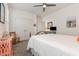 Cozy bedroom with a white quilt bed, ceiling fan, and a double closet at 823 Howard Ave., Myrtle Beach, SC 29577