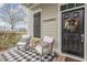 Inviting front porch with comfortable seating, decorative accents, and a 'Welcome to our Porch' sign at 823 Howard Ave., Myrtle Beach, SC 29577