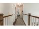 Upstairs hallway, featuring hardwood floors and staircase, with a view of the bedroom at 823 Howard Ave., Myrtle Beach, SC 29577