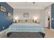 Serene main bedroom with shiplap accent wall, tray ceiling, and a large bed dressed with patterned linens at 823 Howard Ave., Myrtle Beach, SC 29577