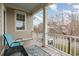 Charming porch with blue chair offers peaceful view of the street at 823 Howard Ave., Myrtle Beach, SC 29577