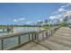 Scenic wooden pier extending over a tranquil lake with green trees on the shoreline at 823 Howard Ave., Myrtle Beach, SC 29577