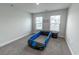 Fun bedroom with unique car bed design, plush carpeting, and ample natural light from bright windows at 860 Saluda River Rd., Myrtle Beach, SC 29588