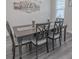 Cozy dining area featuring a dark wood table, seating for six, and stylish décor at 860 Saluda River Rd., Myrtle Beach, SC 29588