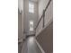 Welcoming entryway with staircase and wood floors, leading into the home's interior at 860 Saluda River Rd., Myrtle Beach, SC 29588