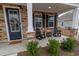 Inviting front porch with stone accents, rocking chairs, and tasteful landscaping at 860 Saluda River Rd., Myrtle Beach, SC 29588