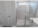 Shower featuring glass door and marble-look tile surround at 860 Saluda River Rd., Myrtle Beach, SC 29588