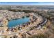 Expansive aerial view of a Primary-planned community, showcasing homes around a central lake at 862 Edgewater Dr., Murrells Inlet, SC 29576