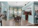 Charming dining area with large windows and views to the kitchen featuring tiled floors at 862 Edgewater Dr., Murrells Inlet, SC 29576