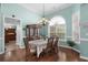 Bright dining room with a chandelier, arched window, and access to the kitchen at 862 Edgewater Dr., Murrells Inlet, SC 29576