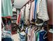 Organized walk-in closet featuring built-in shelving, hanging rods, and ample storage space for clothes and shoes at 862 Edgewater Dr., Murrells Inlet, SC 29576