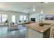 Open-concept living room with hardwood floors and abundant natural light at 92 Costa Ct., Pawleys Island, SC 29585