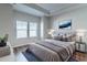 Comfortable main bedroom with large window and en suite bathroom at 92 Costa Ct., Pawleys Island, SC 29585