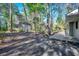 Wooded backyard featuring a deck and partial view of the home's exterior at 935 Little Creek Rd., Myrtle Beach, SC 29572