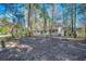 View of the home showcasing a wooded lot and private backyard at 935 Little Creek Rd., Myrtle Beach, SC 29572