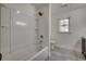 Bathroom with white tub shower and a window near the toilet at 935 Little Creek Rd., Myrtle Beach, SC 29572