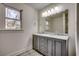 Bathroom with double sink vanity and a large mirror at 935 Little Creek Rd., Myrtle Beach, SC 29572