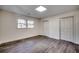 Well-lit bedroom showcasing wood-look flooring and closet space at 935 Little Creek Rd., Myrtle Beach, SC 29572