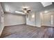 Open and airy living room featuring hardwood-style floors, skylights, and ceiling fan at 935 Little Creek Rd., Myrtle Beach, SC 29572