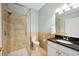 Well-lit bathroom features a walk-in shower with vanity and neutral wall tiles at 938 Wallace Pate Dr., Georgetown, SC 29440