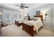 Charming bedroom featuring two twin beds, matching décor, and French doors with shutters at 938 Wallace Pate Dr., Georgetown, SC 29440