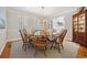 Formal dining room with a large wooden table, seating for eight, and classic window shutters at 938 Wallace Pate Dr., Georgetown, SC 29440