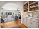 Cozy living room with hardwood floors, comfortable seating, and built-in shelves showcasing decorative items at 938 Wallace Pate Dr., Georgetown, SC 29440