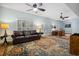 Spacious living room with hardwood floors, decorative rug, ceiling fans, and plenty of natural light at 938 Wallace Pate Dr., Georgetown, SC 29440