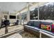 Relaxing sunroom features comfortable seating with views of the outdoor patio and lush landscaping at 938 Wallace Pate Dr., Georgetown, SC 29440