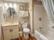 Cozy bathroom with vanity, mirror, toilet, and shower-tub combo, accented with decorative elements at 9820 Queensway Blvd. # 706, Myrtle Beach, SC 29572