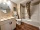 Bathroom with a shower-tub combo, vanity, and tropical-themed decor at 9820 Queensway Blvd. # 706, Myrtle Beach, SC 29572