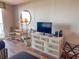 Bedroom featuring a dresser, TV, mirror, and a chair at 9820 Queensway Blvd. # 706, Myrtle Beach, SC 29572